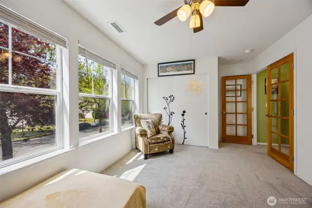 Bedroom 1 features french doors.