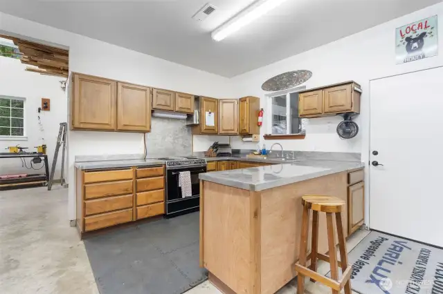 Kitchen inside the SHOP! Door on right leads to outdoor BBQ/ Smoker/ Trager area.