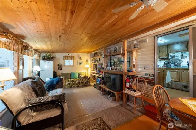 Partially carpeted side room.