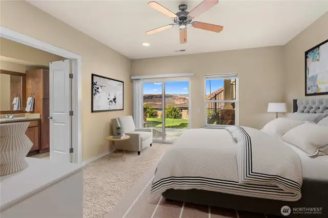 Tranquil primary bedroom with generous layout and large windows for natural light