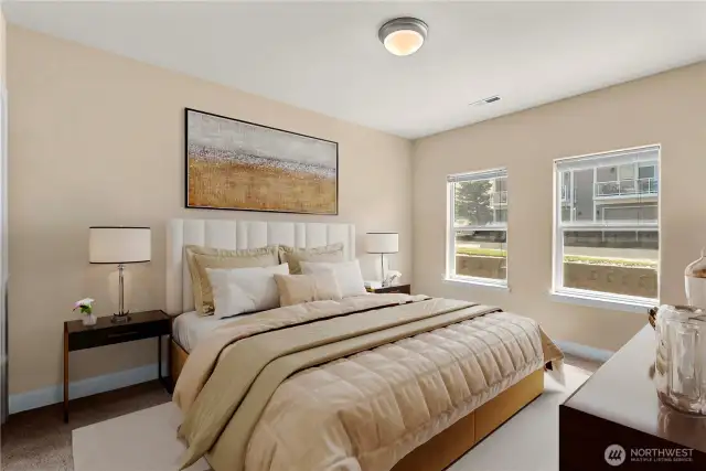 Comfortable secondary bedroom with soft natural light and ample closet space
