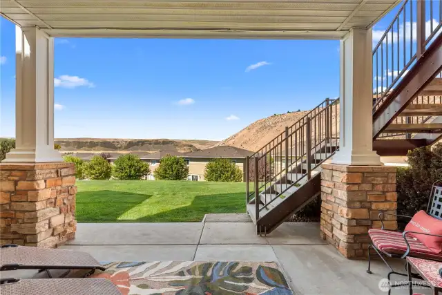 Covered outdoor living space with expansive views - perfect for lounging or dining