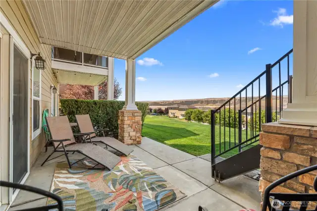 Covered outdoor living space with expansive views - perfect for lounging or dining