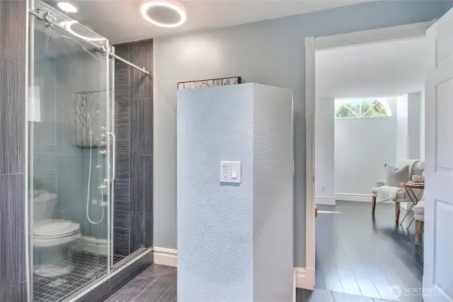 Remodeled bath with tile surround shower and 5 function shower head