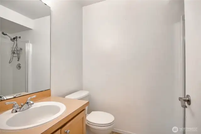 3/4 bathroom with shower and storage nook
