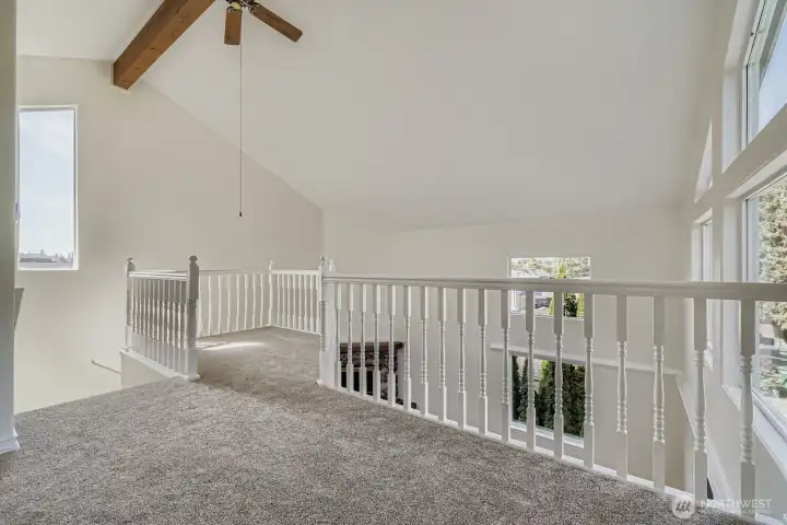 Primary suite open to vaulted ceilingings