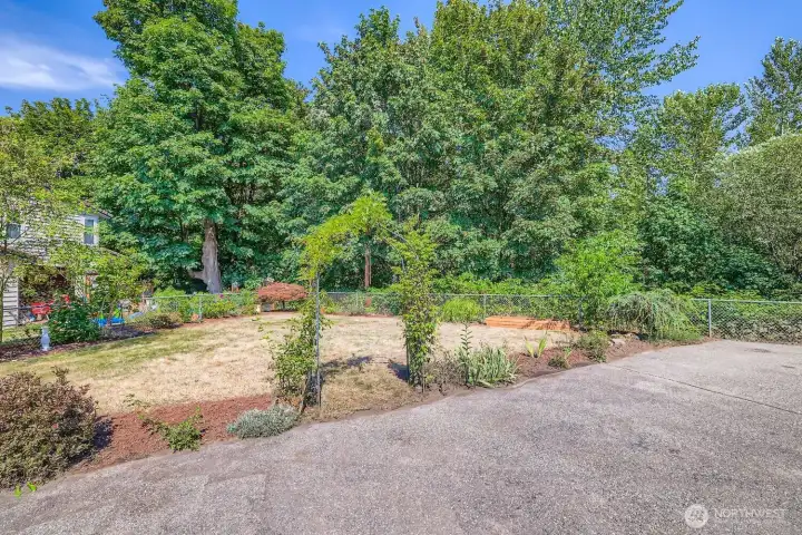 Fenced in yard has plenty of parking and two nice sized garden spaces for your green thumb! Property line goes all the way down to the river beyond the fence.