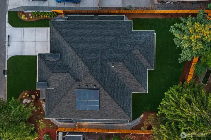 This home contains solar panels. The photo shown above is from a different MN Custom Home with a similar solar array