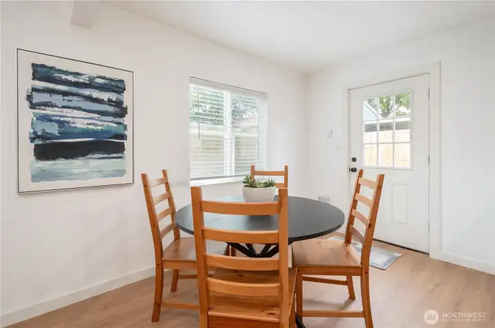 Dining area off of Kitchen, door leads to backyard and garden