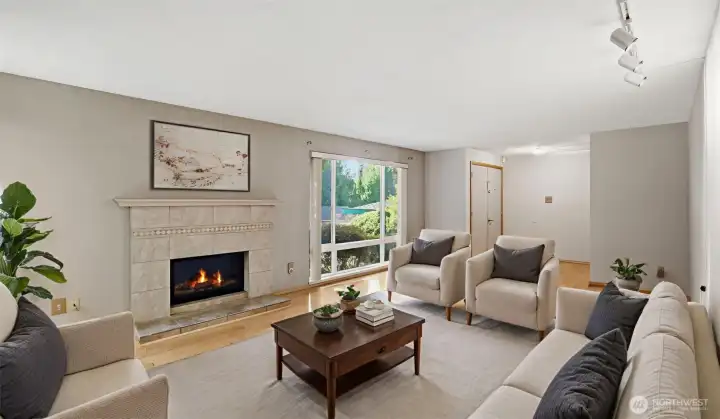 Enter to this light filled and spacious living room complimented with hardwood flooring through and a cozy gas fireplace to keep you warm all winter long! (Virtually Staged)