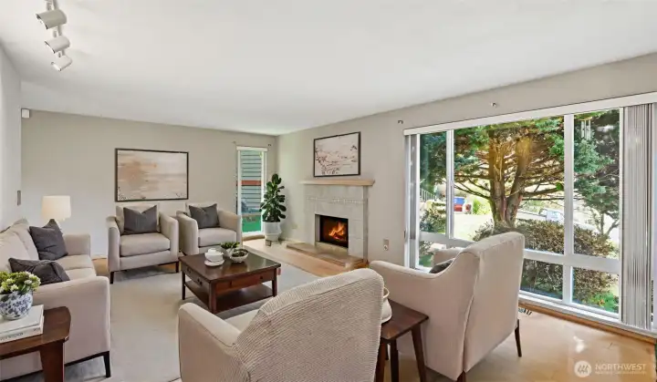 You will love the serene views out the floor to ceiling windows in the cozy living space! (Virtually Staged)