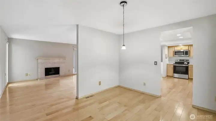 A view of the dining space with the virtual staging, enjoy being just steps from the kitchen for easy serving and cose to the living room for easy hosting.