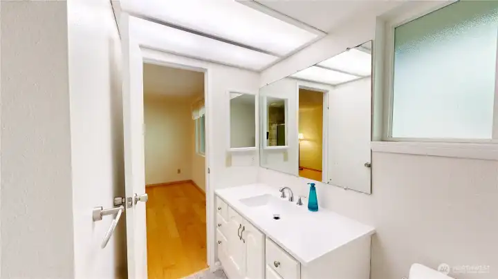The primary en suite is a 3/4 bath with walk-in shower and newer vanity.