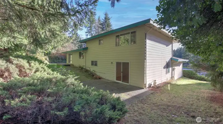 The lower level offers access to the entertainment sized patio space too easily connecting the entire backyard for even more seamless indoor/outdoor living options.