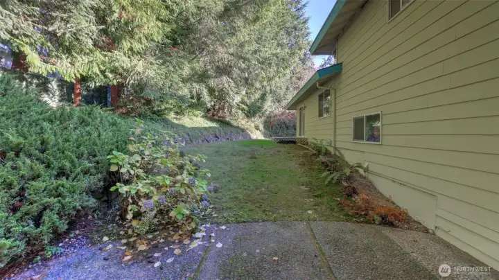 Enjoy the privacy of this tree-lined backyard, ideal for relaxing and entertaining.