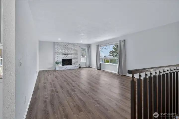 Living room - bright and roomy with a beautiful fireplace to anchor the space