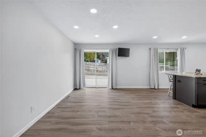 Dining room with slider to back patio, open to (brand new!) kitchen