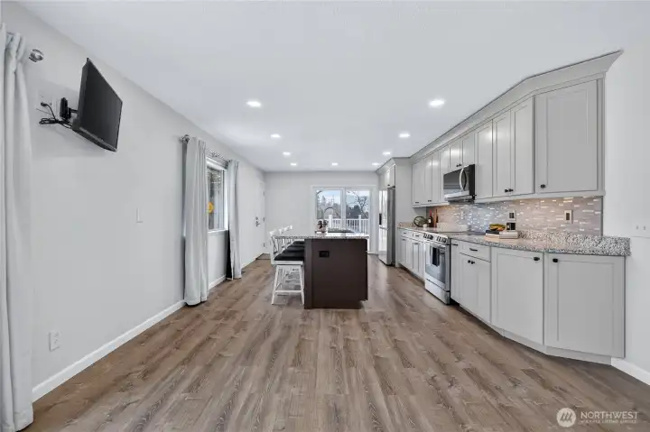 New kitchen, smart appliances, granite counters, custom cabinets.