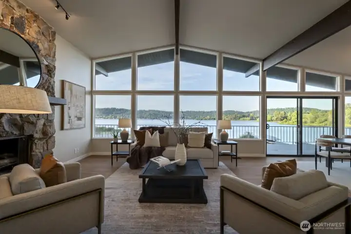 Living room with wall of windows facing the lake