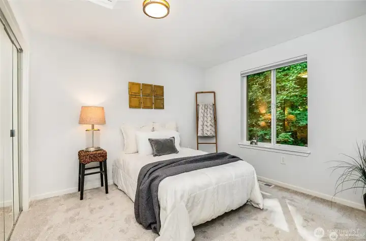 Upper level bedroom is off of loft area and next to guest bath.