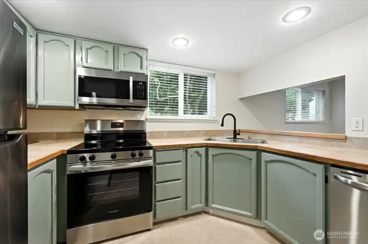 Updated kitchen with stainless appliances and tons of storage space.