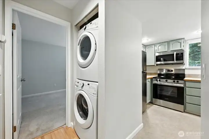 Full sized and stacked washer and dryer.