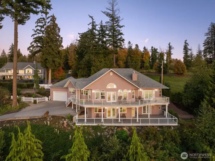 Perched above Semiahmoo Bay, this custom estate glows against a backdrop of evergreens and open sky.