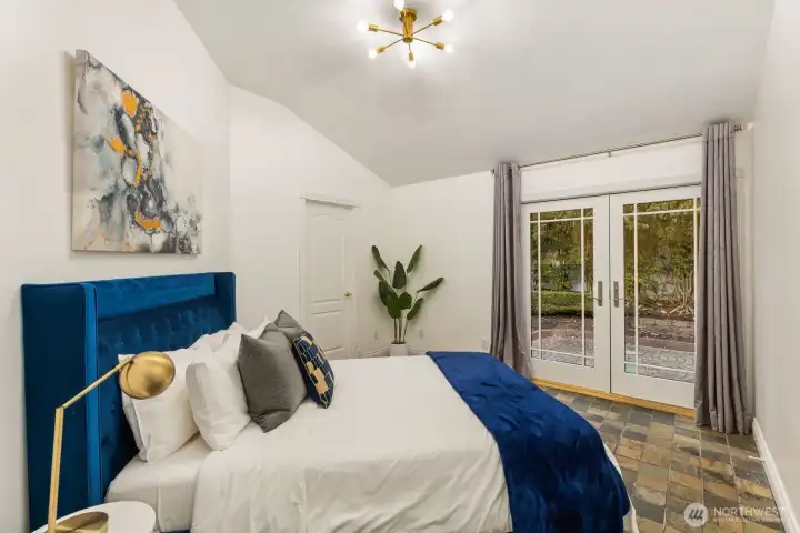 Step directly into your own secret garden from this peaceful guest room.