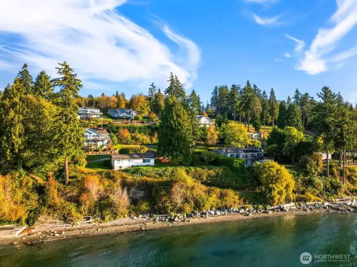 The beach below is just steps away for shoreline strolls and bonfire evenings.