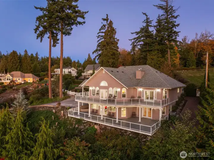 At dusk, this luminous home offers a front-row seat to PNW sunsets.