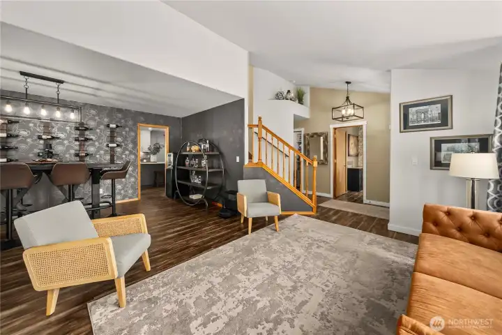 The formal living room flows seamlessly into the dining room, creating an inviting space for gatherings and entertaining.