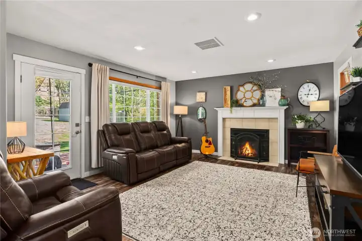 A second gas fireplace in the family room creates a warm, inviting space for movie nights, games, or entertaining.
