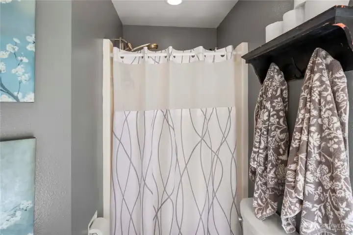 A well-appointed primary bathroom with a separate shower and soaking tub for comfort and convenience.