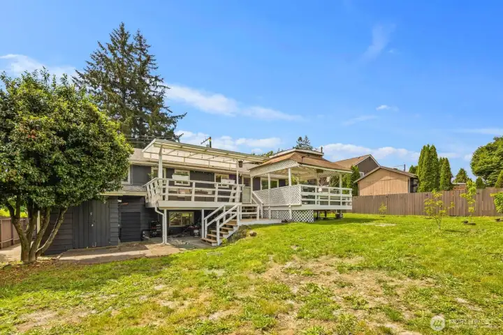 Spacious fully fenced backyard offering plenty of privacy, complete with an abundance of planted fruit trees and room to relax, garden, or entertain.