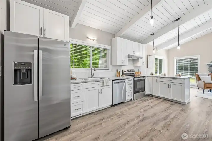Updated kitchen with newer appliances, cabinetry, and open-concept layout