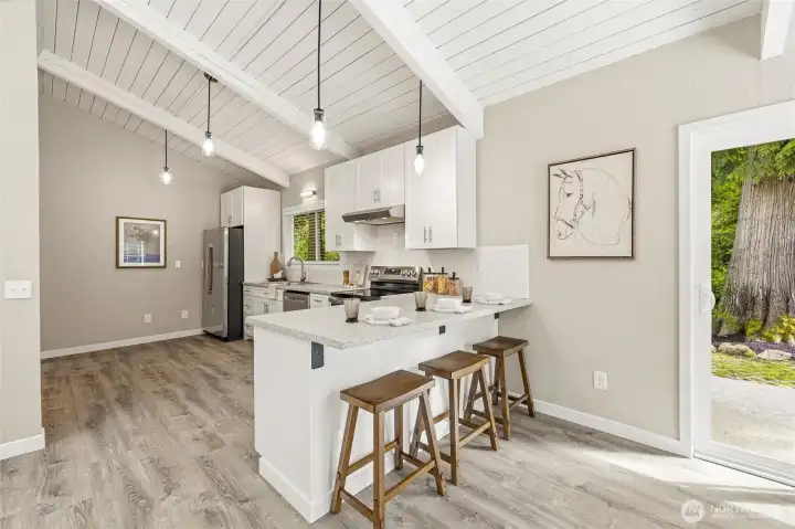 Functional kitchen layout with updated finishes and gathering space