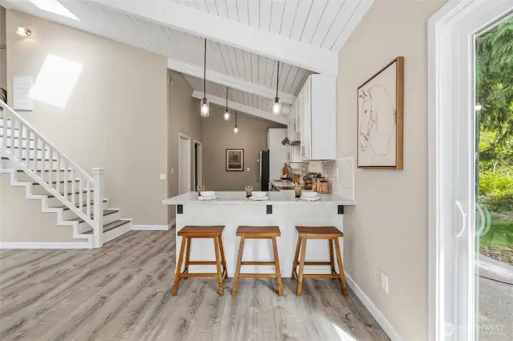Open-concept layout connecting kitchen, dining, and living spaces