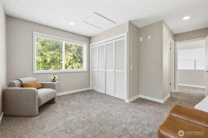 Flexible bedroom space with natural light and storage