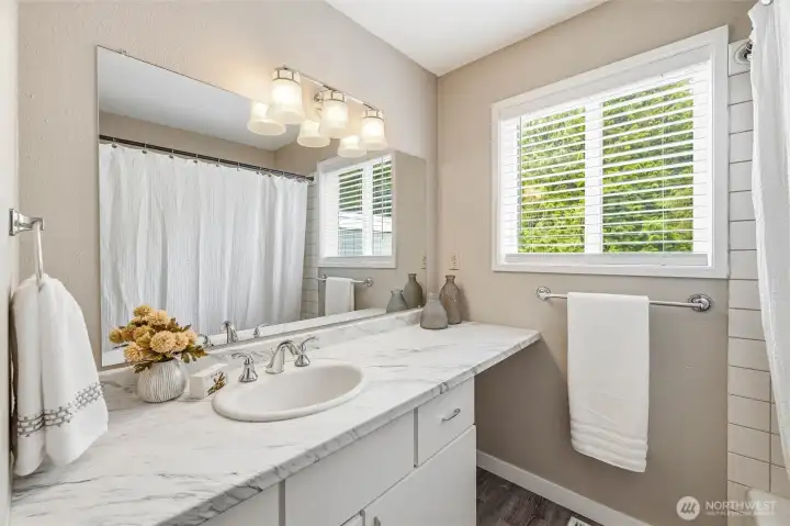 Updated bathroom with modern fixtures and finishes