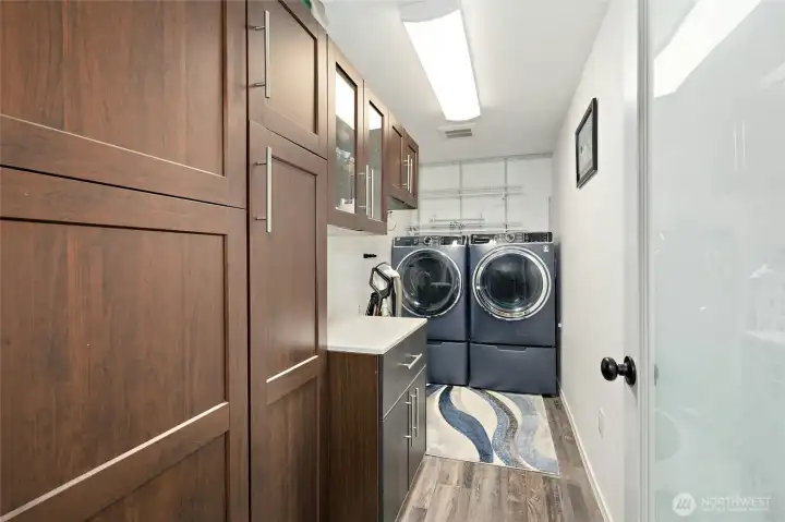 Main laundry room and pantry. Second laundry is in the attached garage off front of home. Main laundry room and pantry. Second laundry is in the attached garage off front of home.