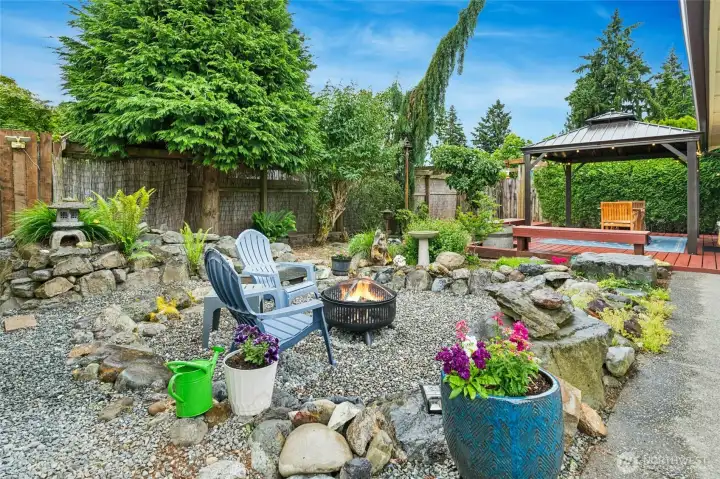 This firepit area was once a water feature and pond. Use as is or restore with new pump and liner. This firepit area was once a water feature and pond. Use as is or restore with new pump and liner.