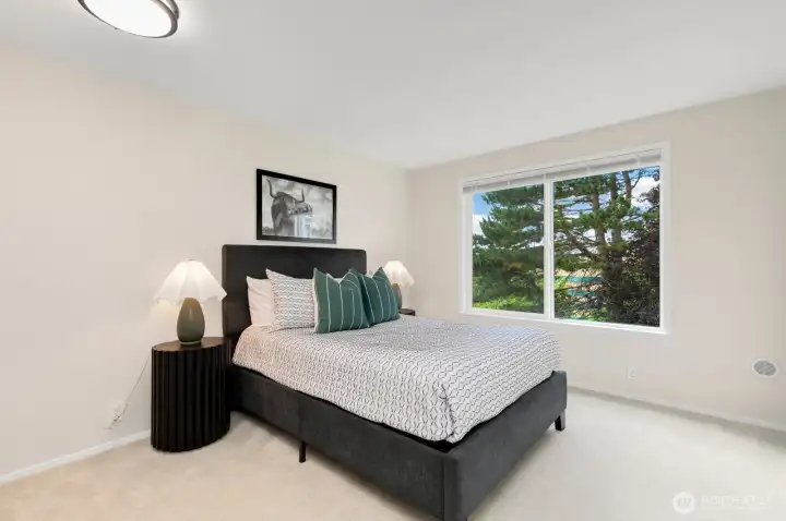 Spacious bedroom with full closet looking over grass and greeenbelt. Spacious bedroom with full closet looking over grass and greeenbelt.