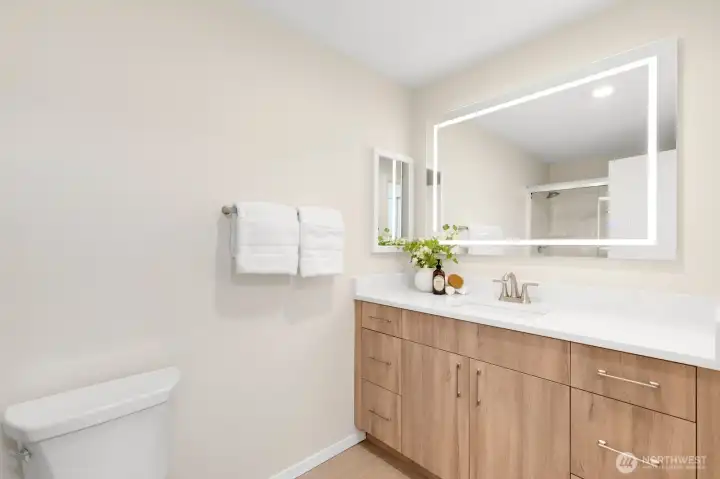 Primary bathroom with plenty of counter space, an LED dimmable mirror with anti-fogger, and a full length walk-in shower. Primary bathroom with plenty of counter space, an LED dimmable mirror with anti-fogger, and a full length walk-in shower.