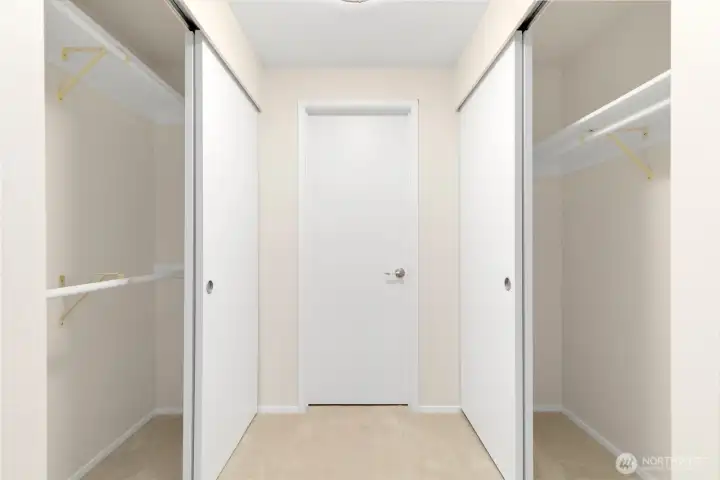 Primary bedroom closets. Primary bedroom closets.