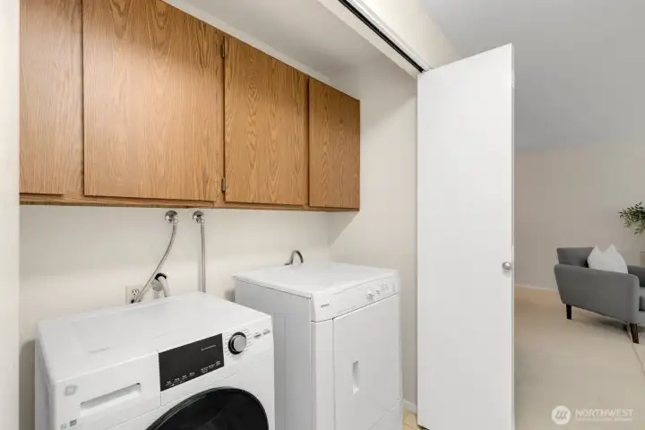 Laundry with storage cabinets. There is a dedicated interior storage room as well behind the fireplace. Laundry with storage cabinets. There is a dedicated interior storage room as well behind the fireplace.