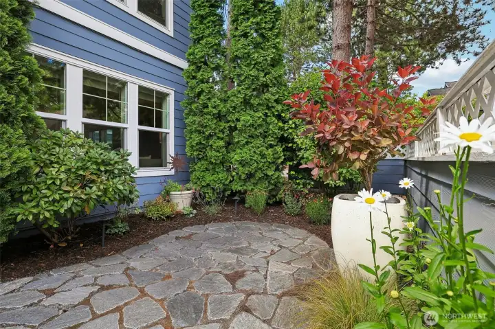 Lower corner unit with stone pathway to landscaped oasis. Lower corner unit with stone pathway to landscaped oasis.