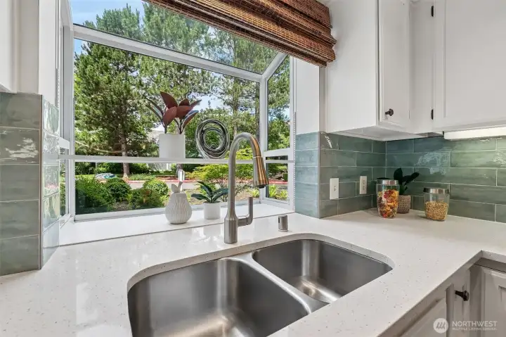This kitchen has it all including a garden window to place your plants and decoor. This kitchen has it all including a garden window to place your plants and decoor.