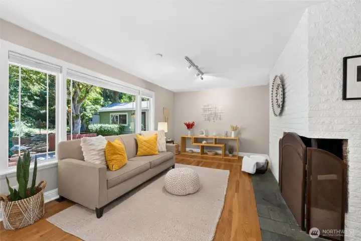 Large picture windows fill the home with natural light while framing peaceful views of the private backyard Large picture windows fill the home with natural light while framing peaceful views of the private backyard