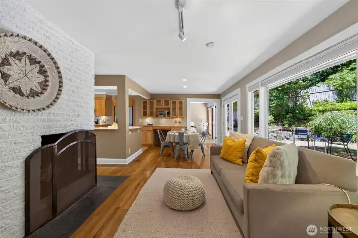 Relax in a bright, inviting living room centered around a cozy fireplace Relax in a bright, inviting living room centered around a cozy fireplace