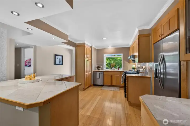 A thoughtfully placed kitchen island enhances both the function and flow of this warm, inviting kitchen. A thoughtfully placed kitchen island enhances both the function and flow of this warm, inviting kitchen.